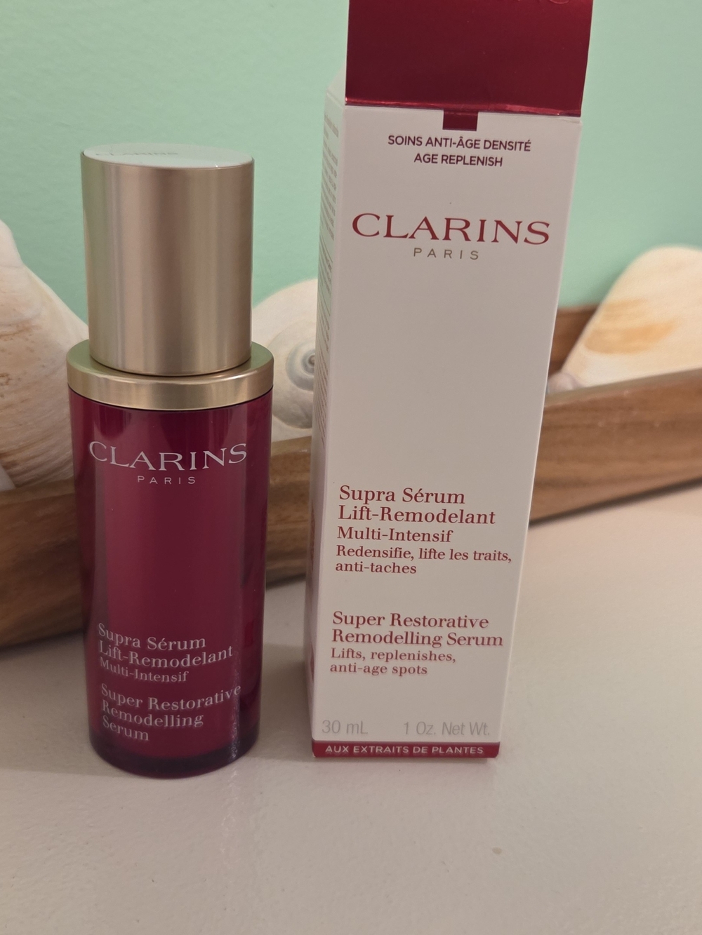 Clarins Supra Sérum in deep burgundy with gold cap